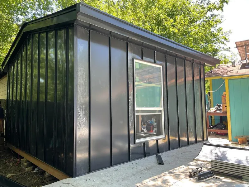 Black standing seam metal wall panels for Roof Inspection in La Grange Park