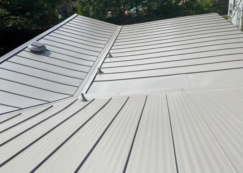 Solar attic fan installed on a metal roof for Roof Ventilation in La Grange Park